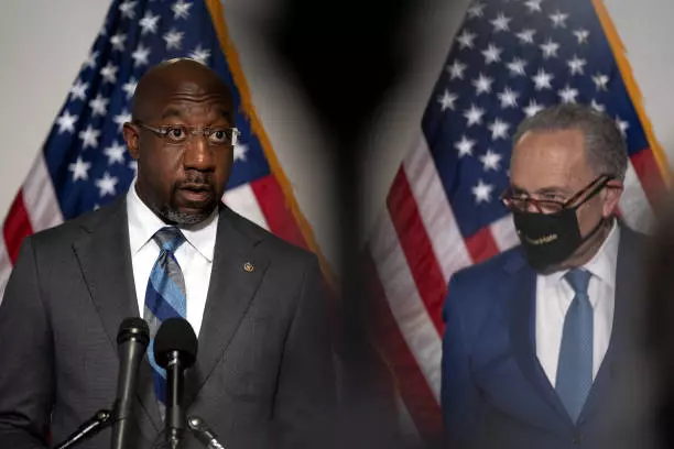 Senator Raphael Warnock and Chuck Schumer